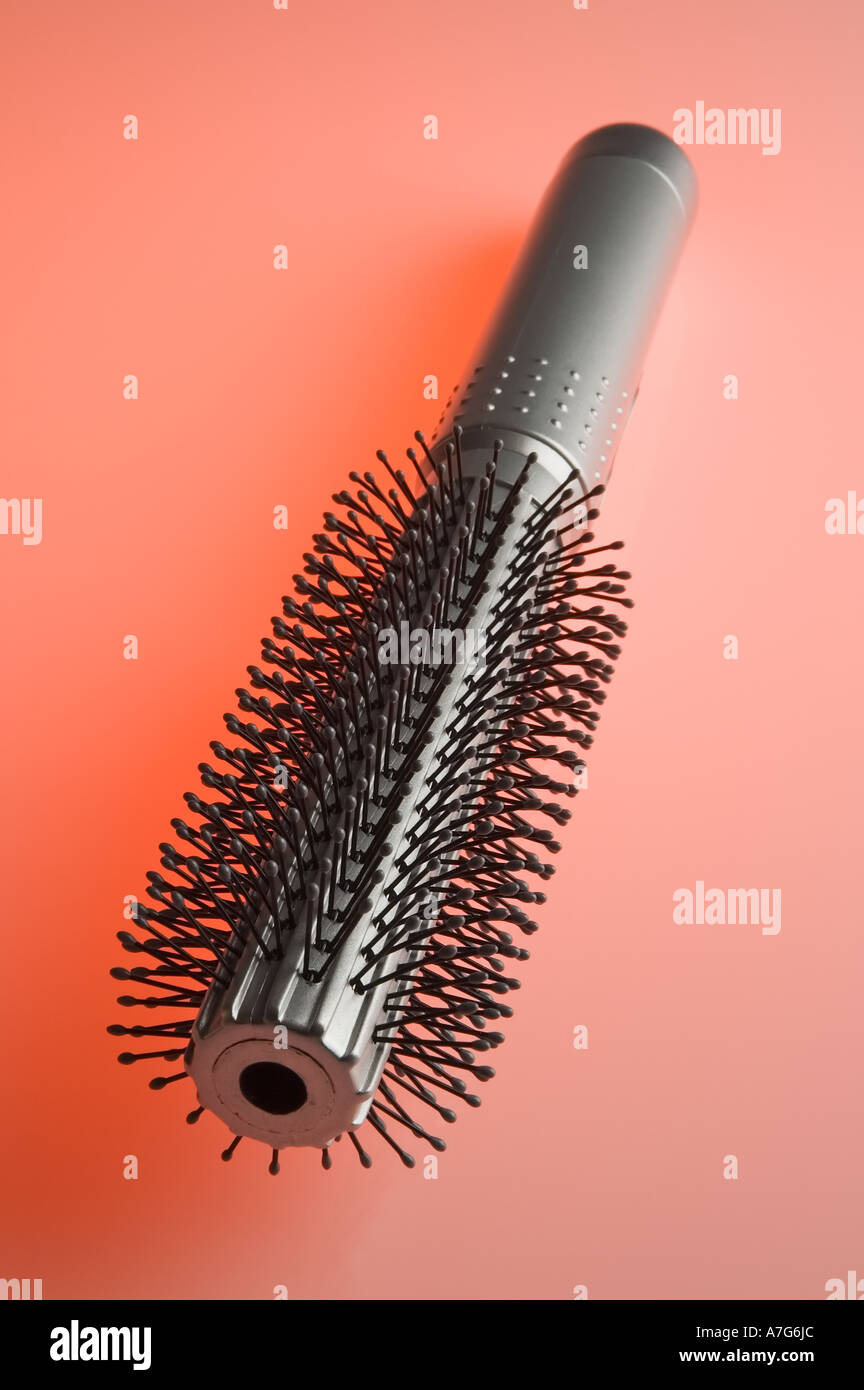A hairbrush on a red background Stock Photo