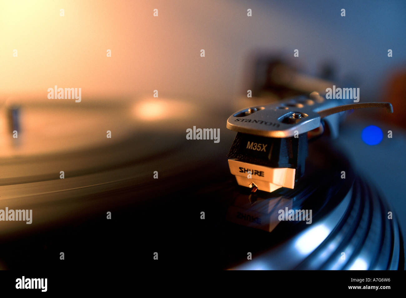 Spinning dj turning vinyl and records Stock Photo