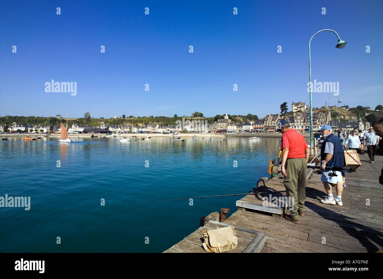2 FISHERMEN ON PIER HARBOUR  CANCALE  BRITTANY FRANCE Stock Photo