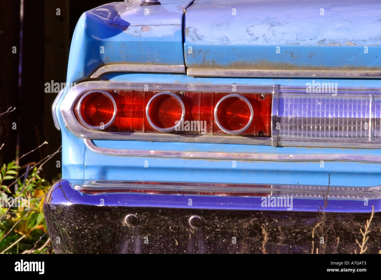 Rear lights and bumper of old blue car Stock Photo Alamy