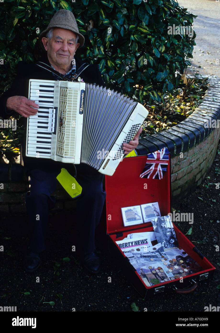 Old Man Busking At Diss In Norfolk in the Uk Stock Photo