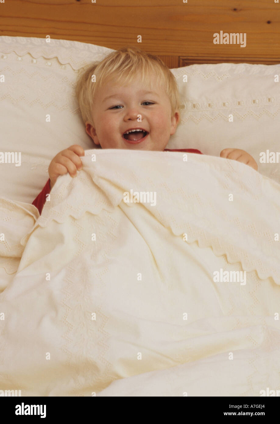 Portrait Of Two Year Old Boy In Bed in the Uk Stock Photo Alamy