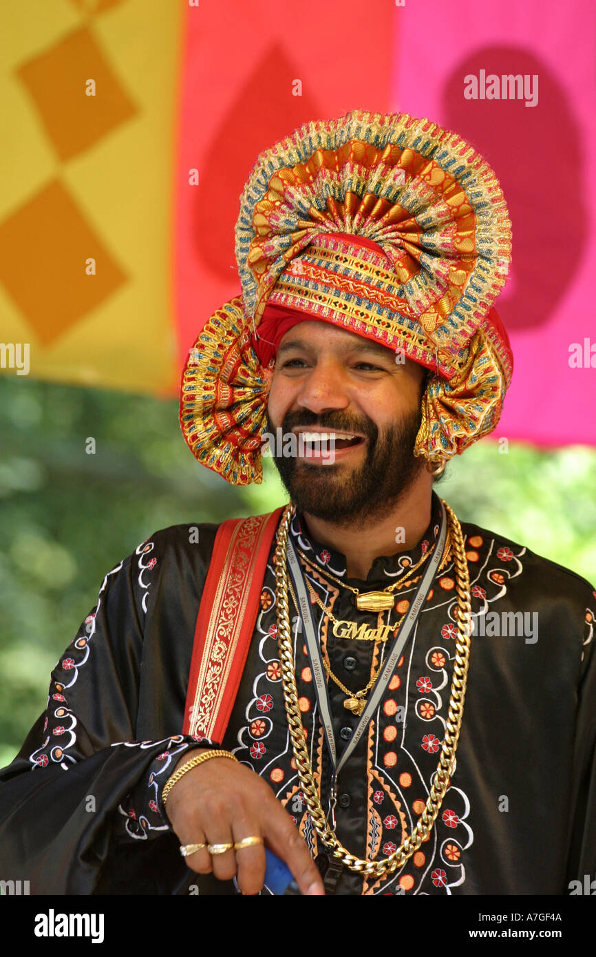 A drummer enjoying himself during a performance of traditional Indian music at the Swindon Mela Stock Photo