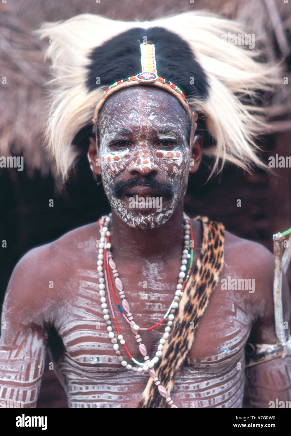 Close Up Portrait Of Traditional Kikuyu Man Wearing A Cap Made From Close Up Portrait Of Traditional Kikuyu Man Wearing A Cap Made From