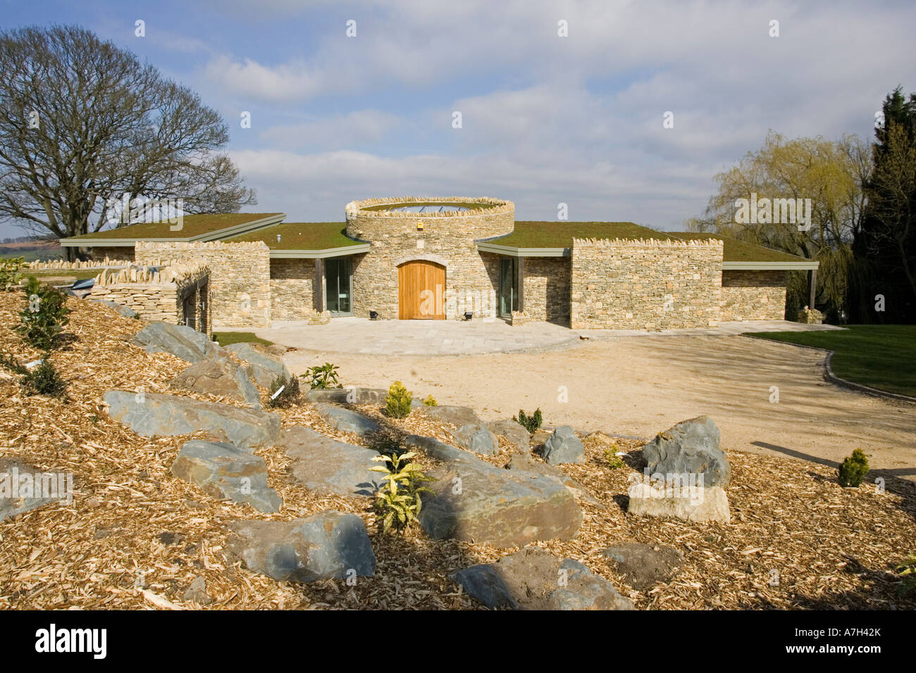 New expensive upmarket innovative Cotswold stone house with turf roof
