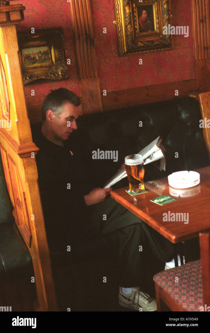 older-man-sitting-reading-newspaper-in-pub-stock-photo-alamy
