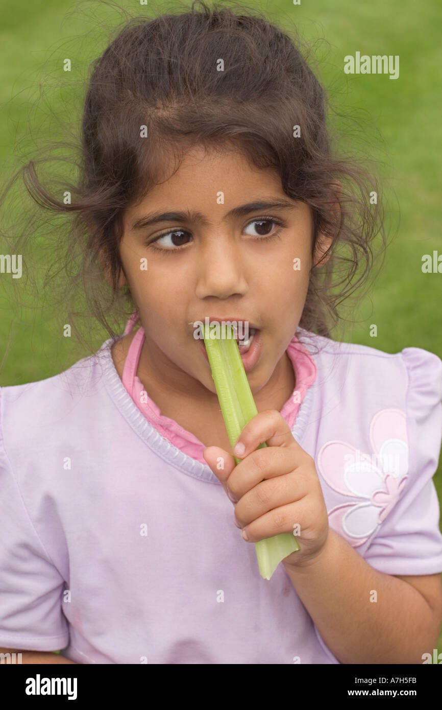 Young Girl 6 years Eating Celery Stick Stock Photo Alamy
