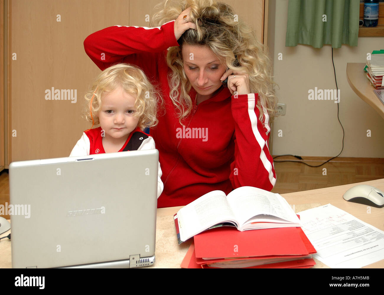 mother with child in office Stock Photo