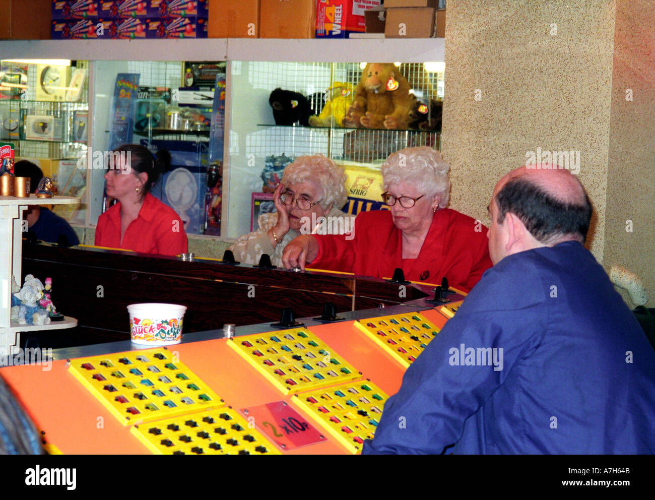 People playing bingo in a games arcade Stock Photo Alamy