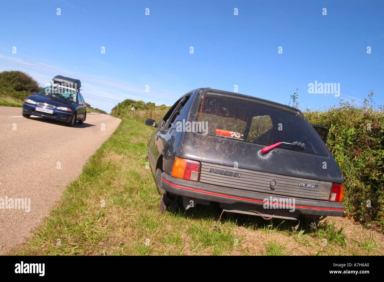 Car dumped in countryside hi-res stock photography and images - Alamy