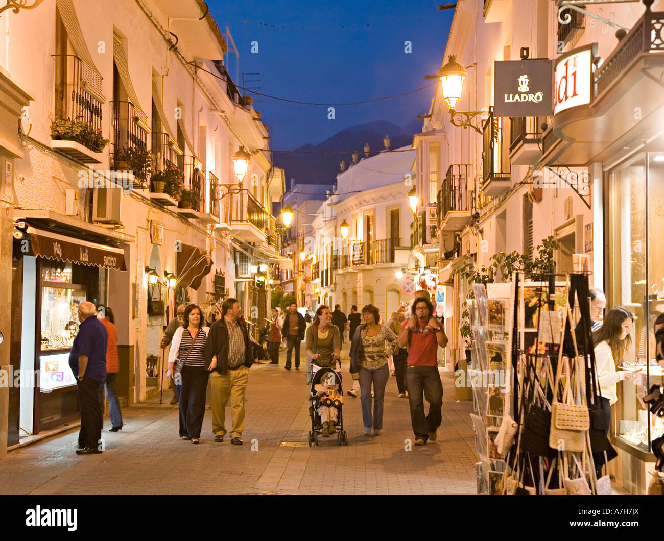 Tourists shopping at dusk in Nerja Spain Stock Photo Alamy Tourists shopping at dusk in Nerja Spain Stock Photo Alamy