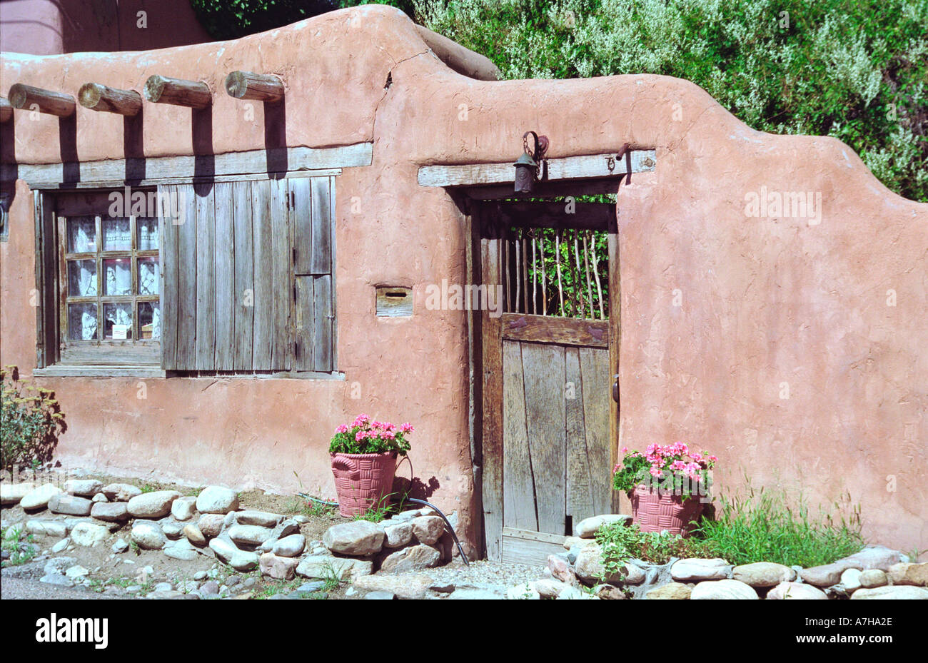 Adobe Wall and Wood door in Santa Fe New Mexico Stock Photo