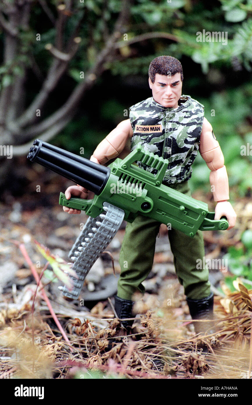 Action Man toy figure as commando special forces with machine gun Stock Photo