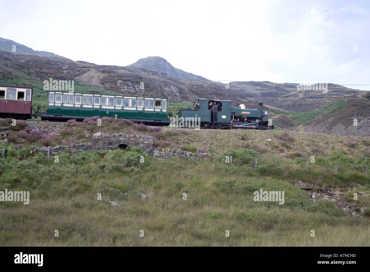 Steam train on the Ffestiniog railway above Tanygrisiau reservoir