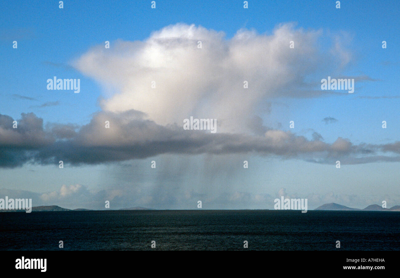 Cumulonimbus cloud with precipitation over the Outer Hebrides, Scotland. Stock Photo