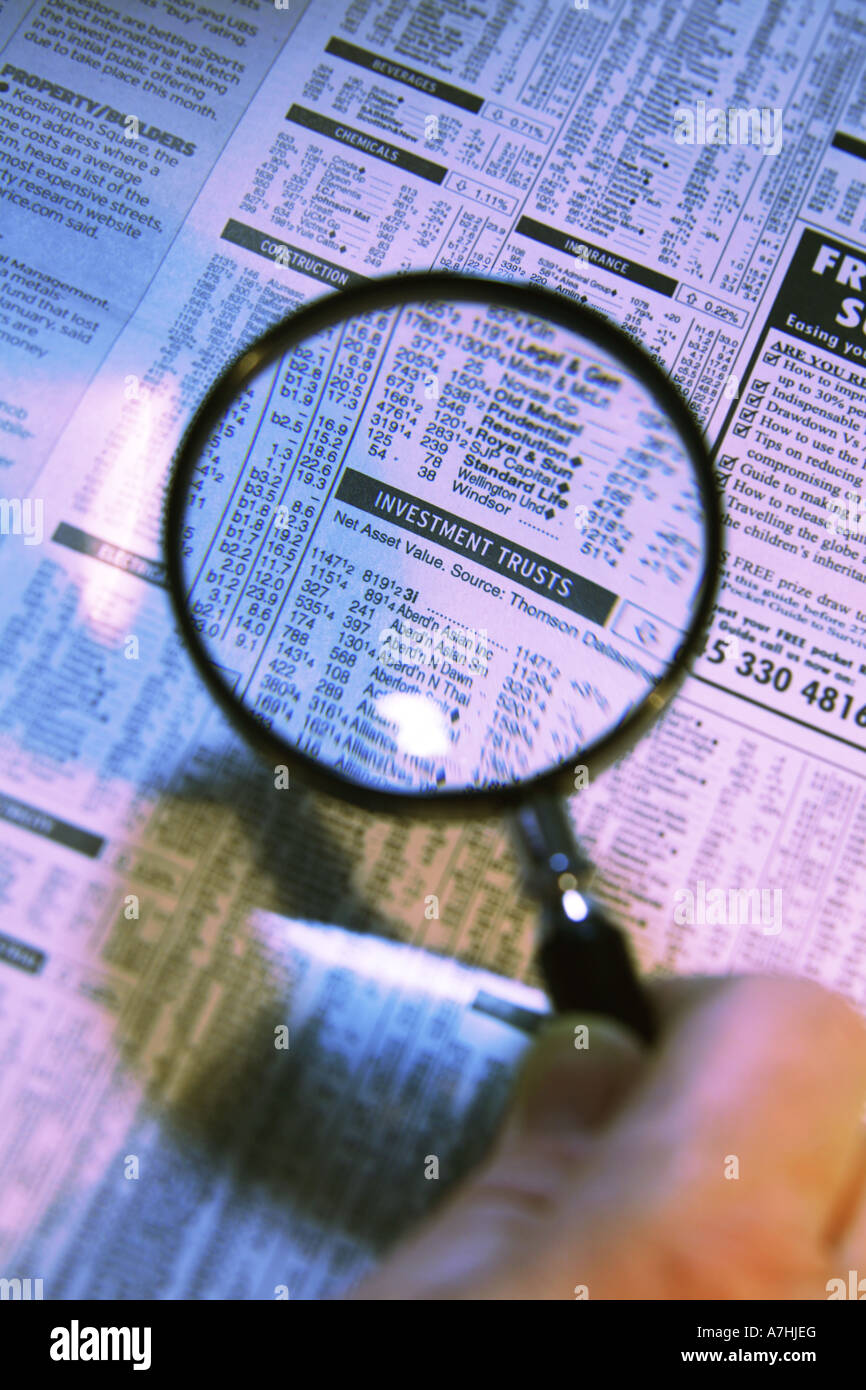Investment Trust Companies Share Prices under a Magnifying Glass Stock Photo