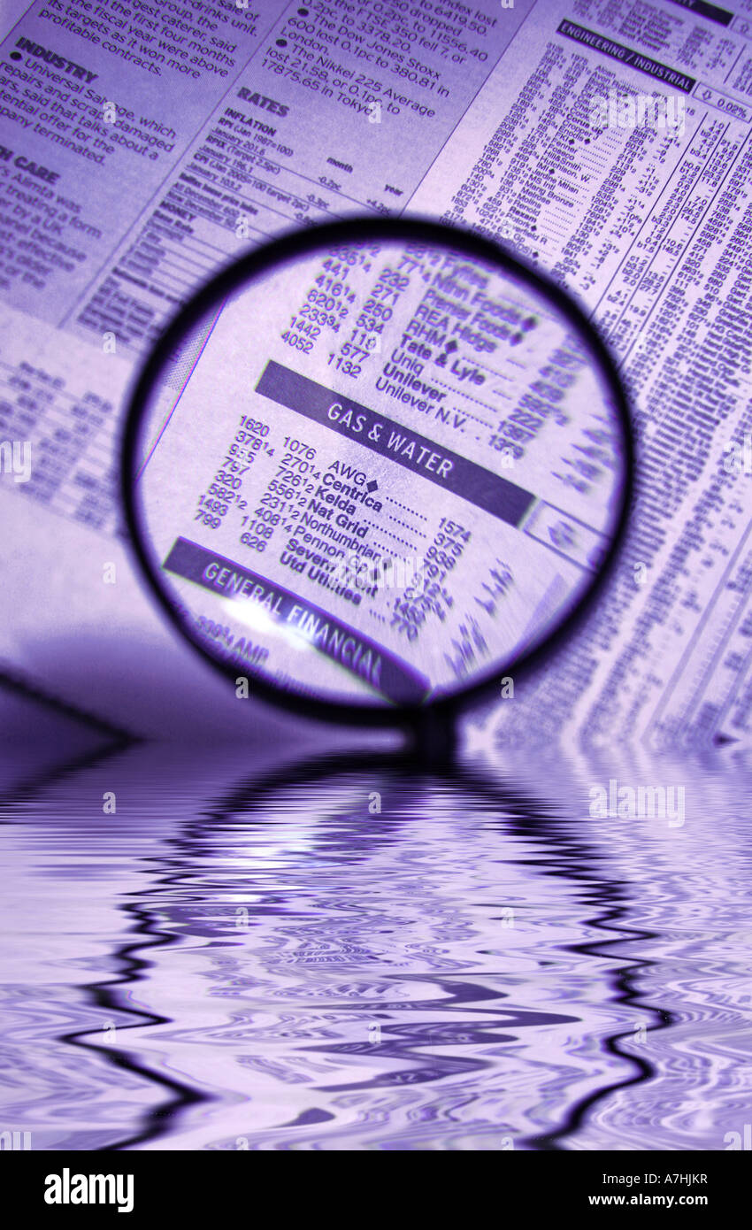 Gas and Water Utility Companies Share Prices under a Magnifying Glass with water concept Stock Photo