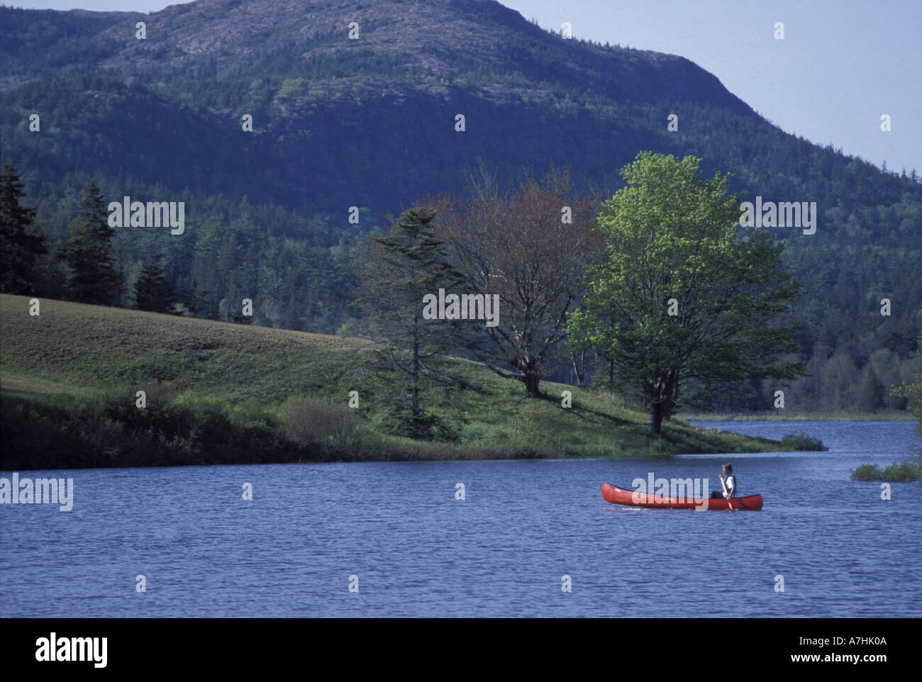 North America, US, ME, Canoeing. Little Long Pond. Parkman Mtn. Spring. (MR) Stock Photo