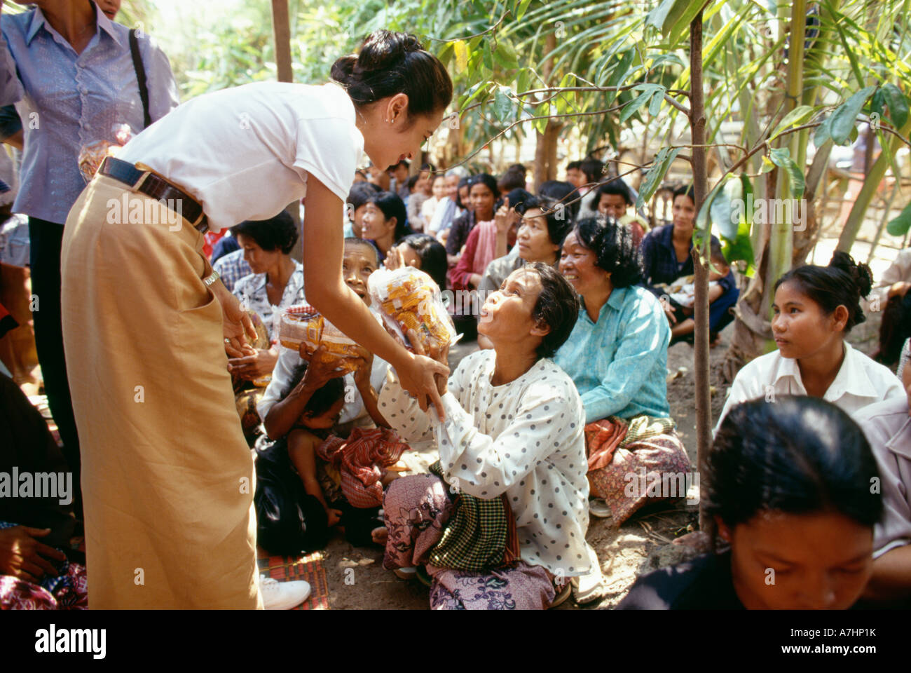 Princess Rattana Princess Rattana Norodom of Cambodia handing out alms and interacting ...