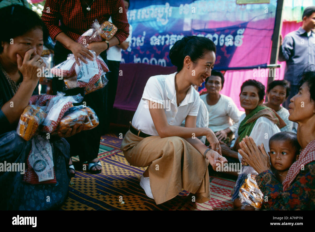 Princess Rattana Princess Rattana Norodom of Cambodia handing out alms and interacting ...