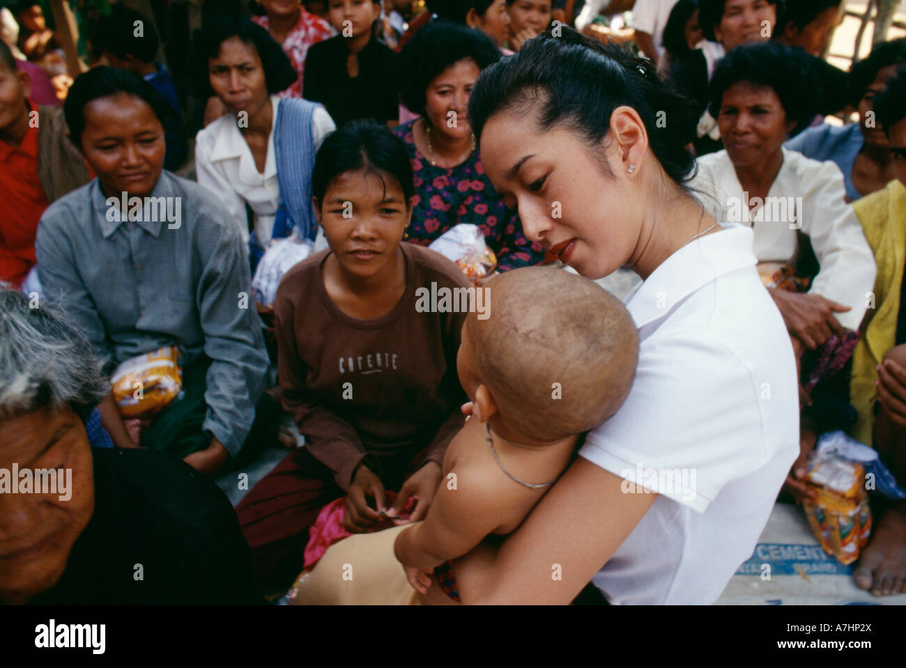 Princess Rattana Princess Rattana Norodom of Cambodia handing out alms and interacting ...