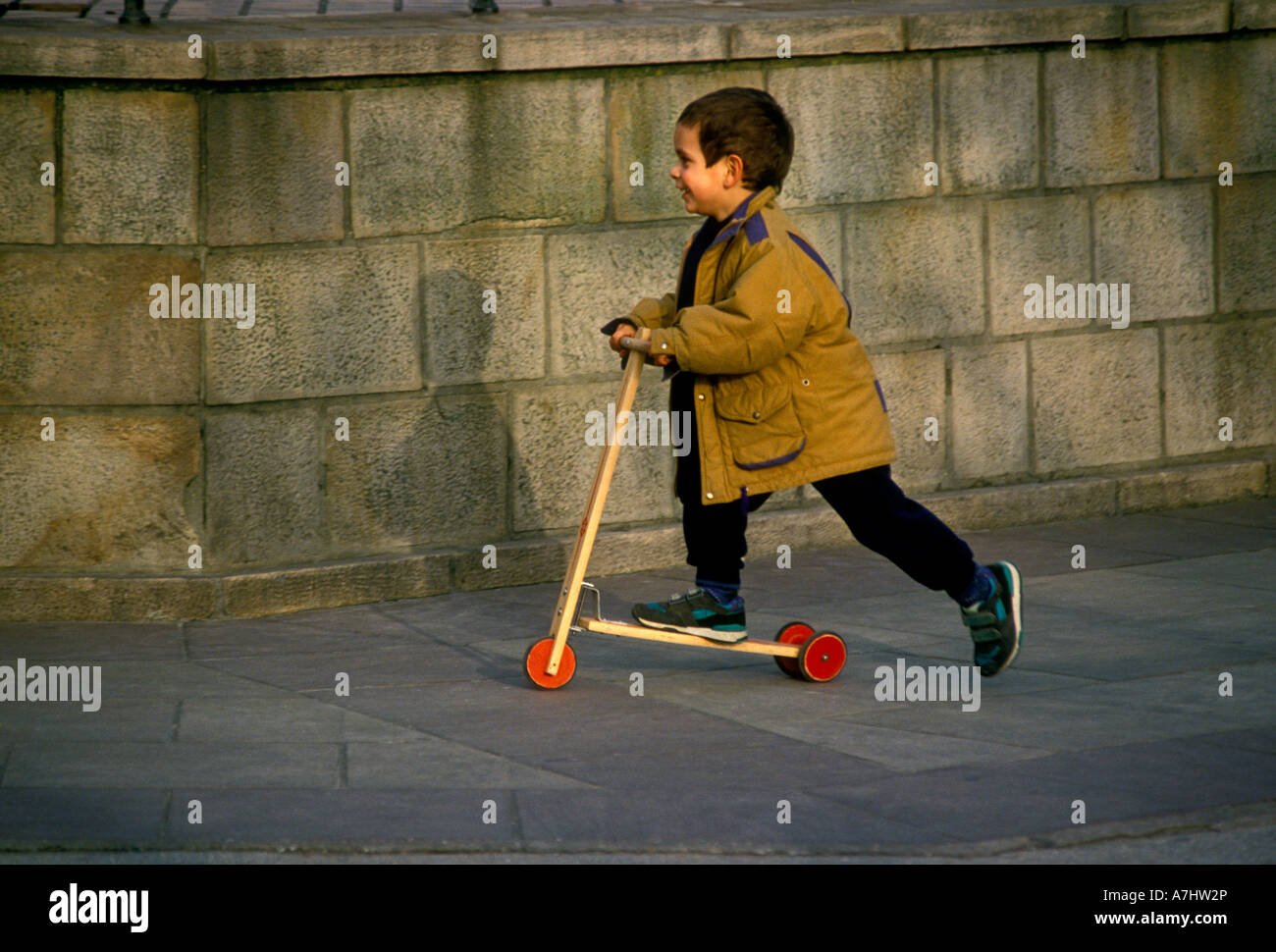 French Boy Young Boy Male Child Riding Trotinette Place Louis Xiv French Basque Country Town Of Saint Jean De Luz Saint Jean De Luz France Stock Photo Alamy