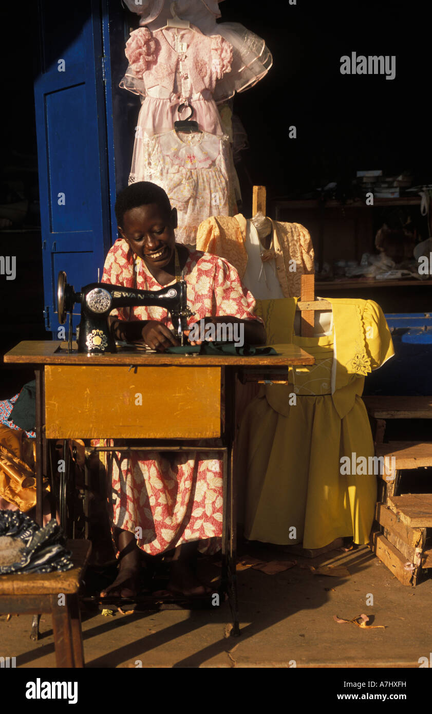 woman sowing clothes in the market Jinja Uganda Stock Photo Alamy