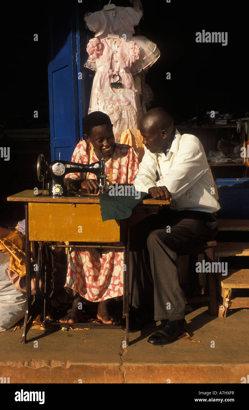 woman sowing clothes in the market Jinja Uganda Stock Photo Alamy
