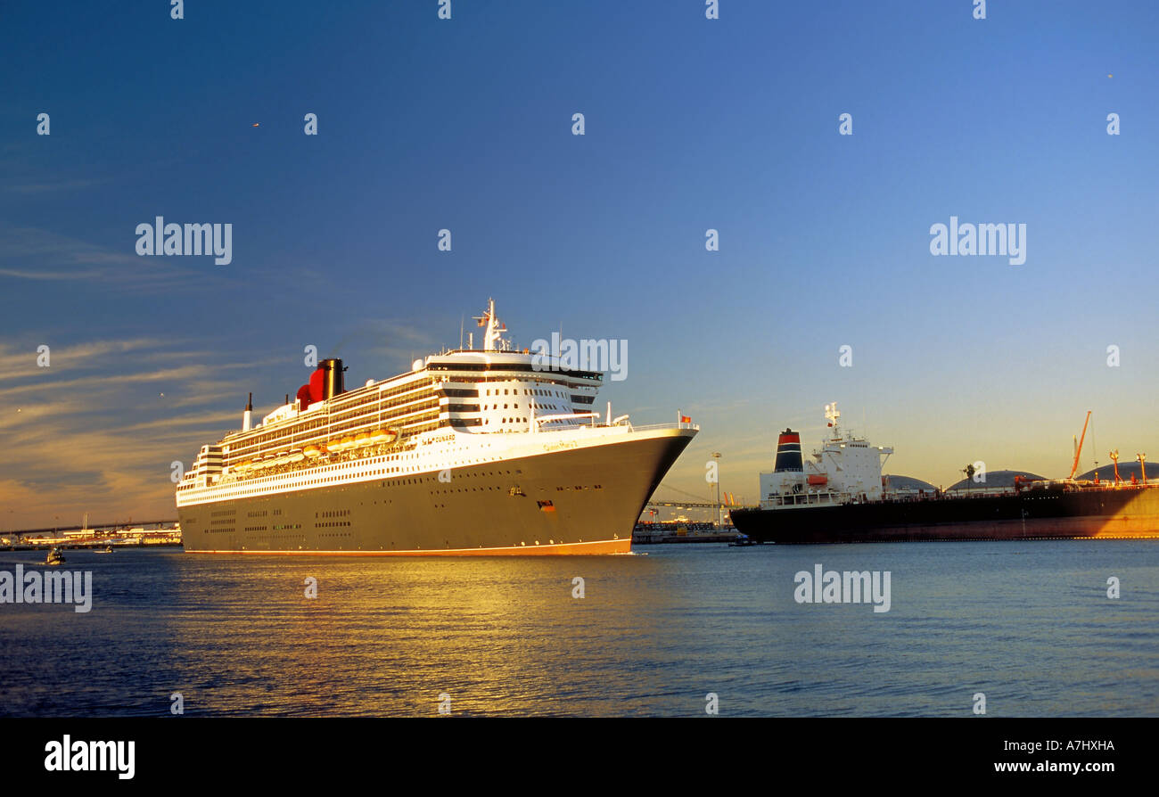 The magnificent Queen Mary 2 on her way out to sea in San Pedro harbor, Los Angeles, California Stock Photo