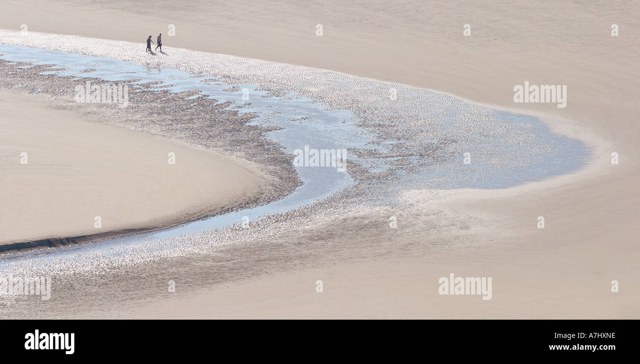 Beach walkers Stock Photo