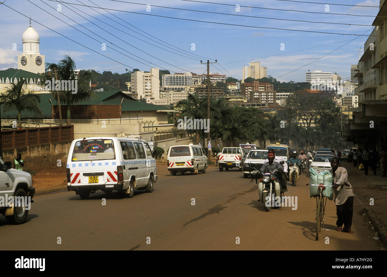 Kampala streetscene matatus minibusses that serve as public transport are the main transport on the streets Uganda Stock Photo
