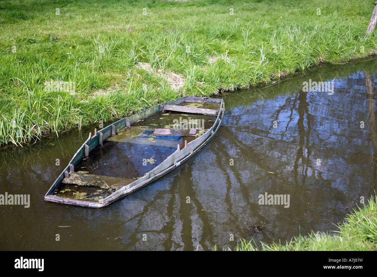 Sunken rowing boat in a ditch, Holland Stock Photo