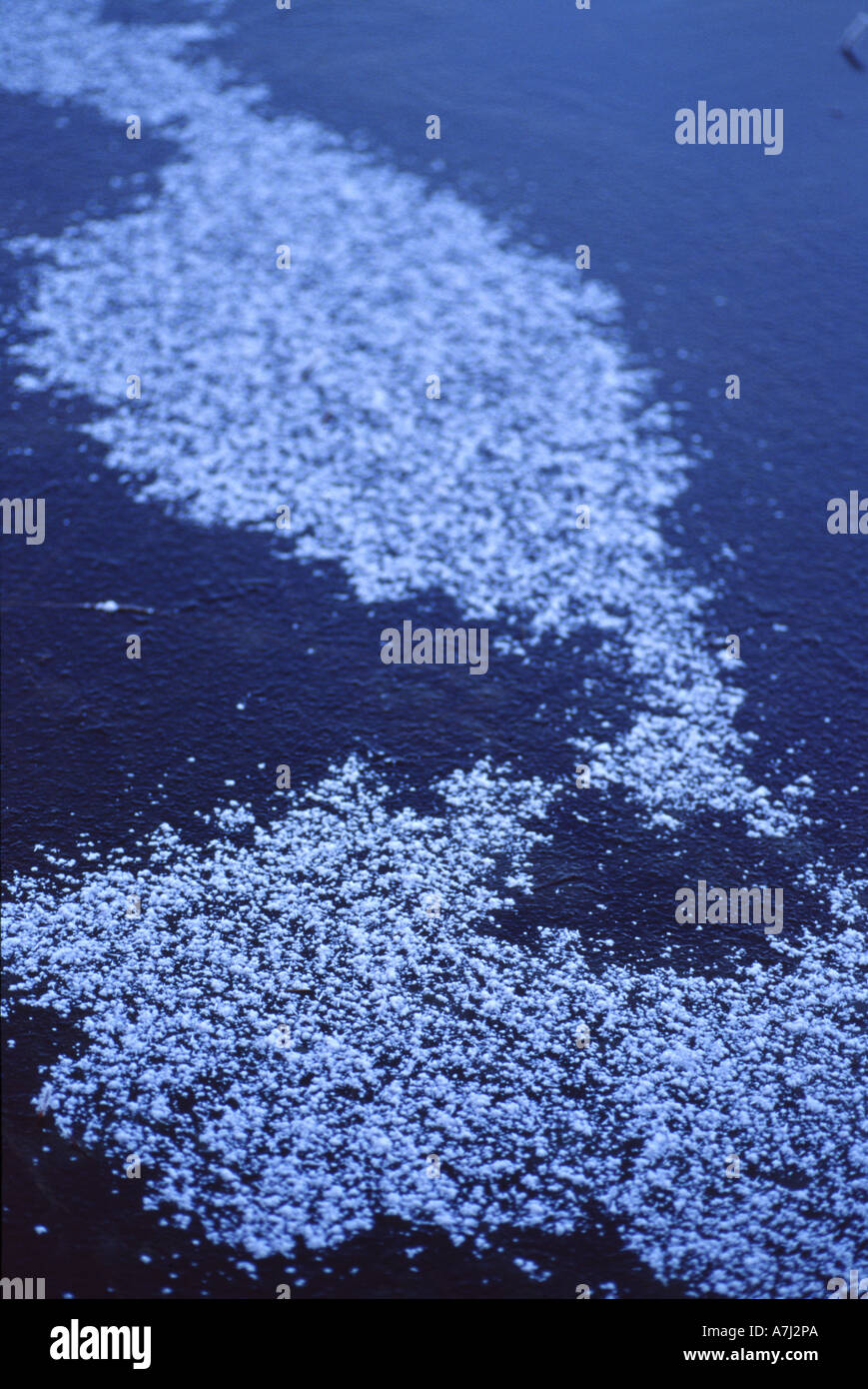 Snow on the frozen lake created an abstract pattern Stock Photo