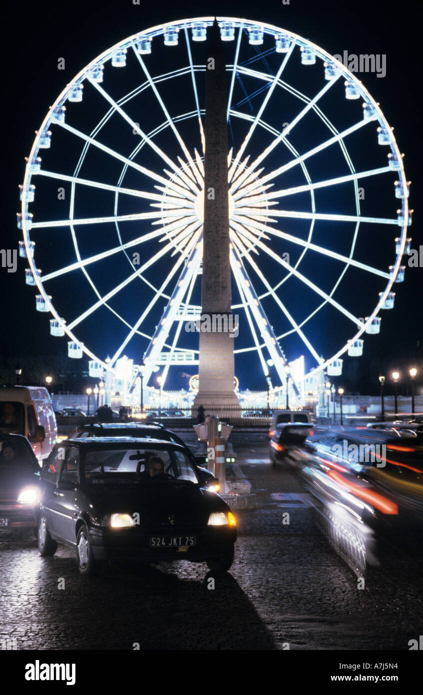 Obelisk of Luxor in front of an illuminated Ferris wheel, Place de la Concorde, Paris Stock Photo