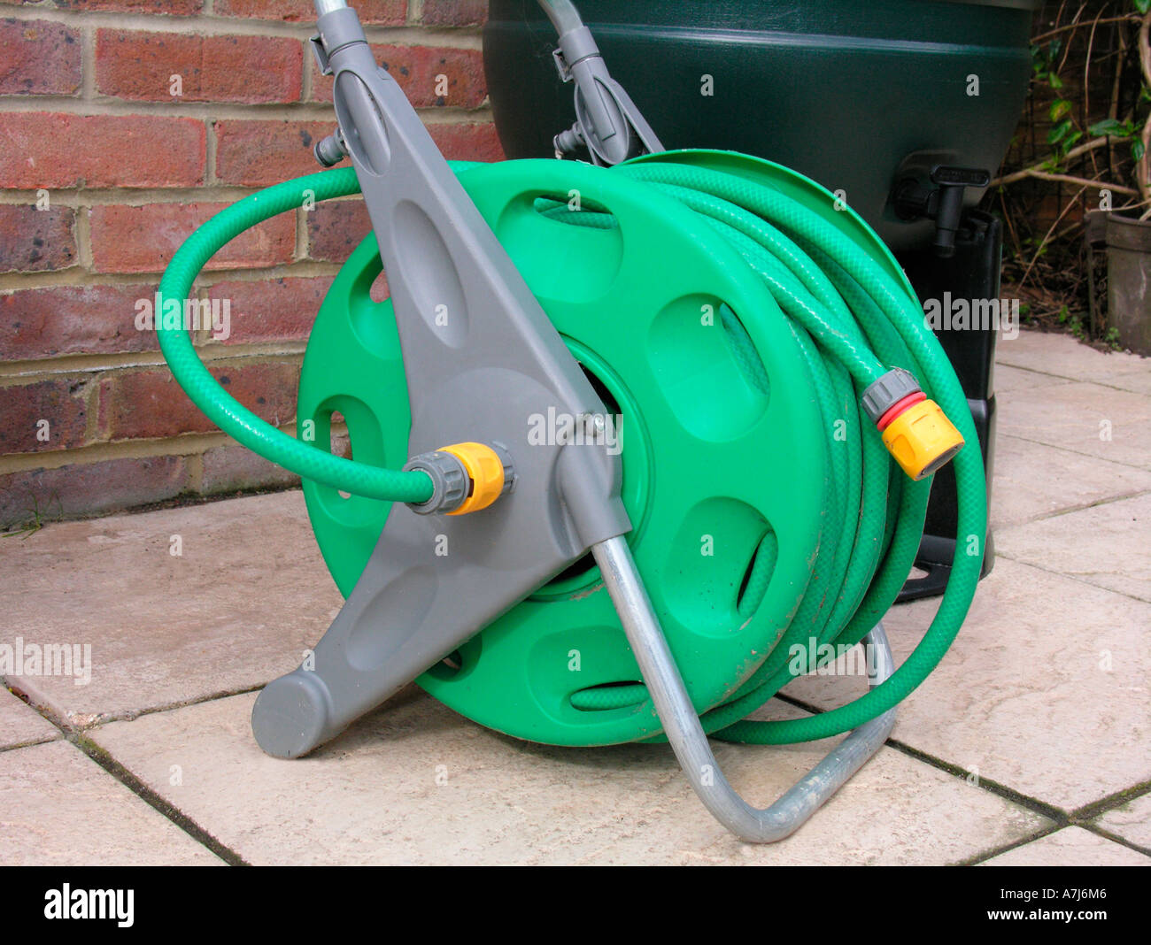 hose reel in garden laying dormant with the hosepipe ban in force in