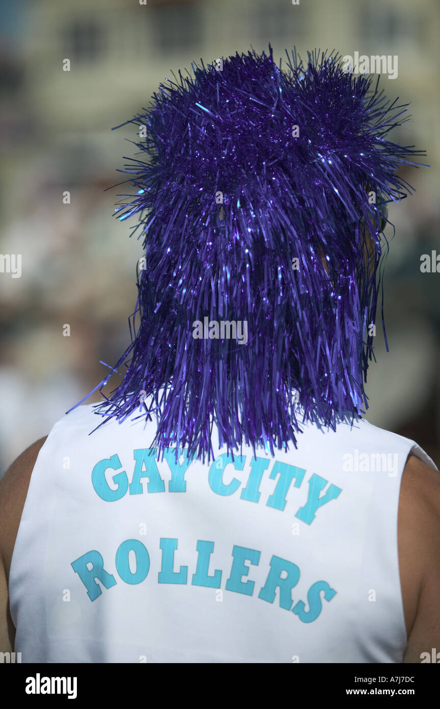 Rear view of man wearing a blue wig and a Gay City Rollers t shirt at Brighton Pride Stock Photo