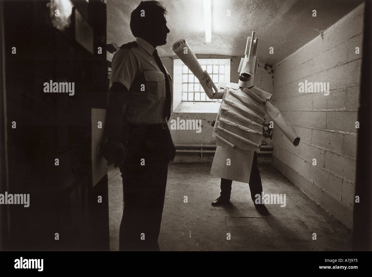 A Dartmoor prison lifer dressed in a paper Origami costume in his cell rehearsing for an opera sponsored by Glyndebourne Stock Photo