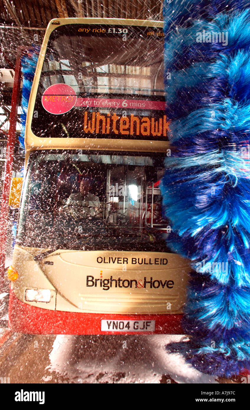A giant blue car wash brush scrubs a bus clean at Brighton Hove Bus and