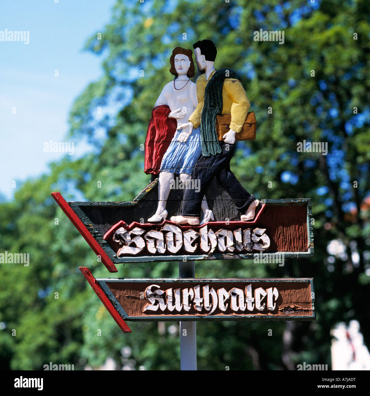 D-Bad Liebenstein, Grum brook, Werra Valley, nature reserve Thuringian Forest, Thuringian Forest, Thuringia, wood carved sign to the bath house and to the spa theatre, image of a young couple walking Stock Photo
