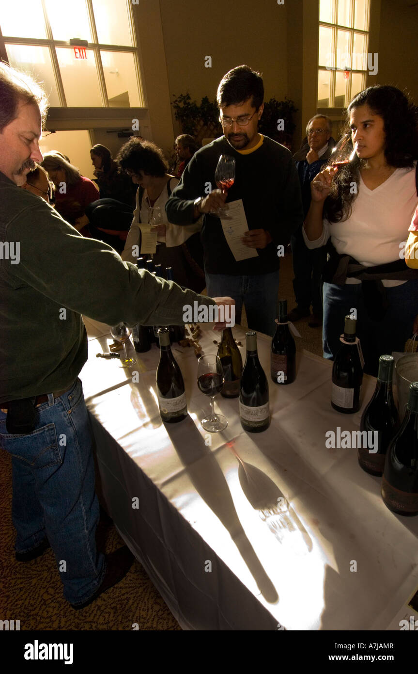 Willamette Valley Vineyards winemaker Forrest Klaffke pours wine at consumer tasting event Stock Photo