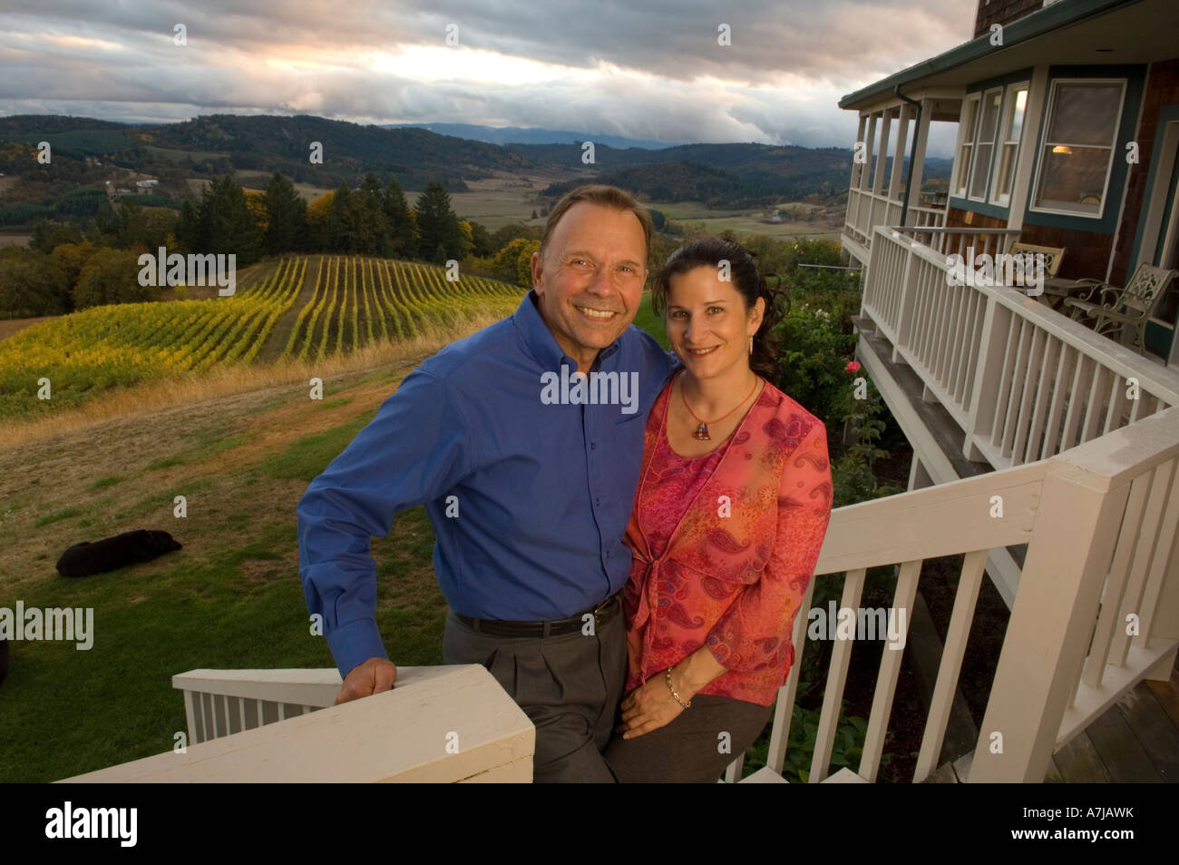 Owners Wayne  & Nicolette Bailey of Youngberg Hill Vineyards Inn pose for a portrait on the deck of their B&B Stock Photo