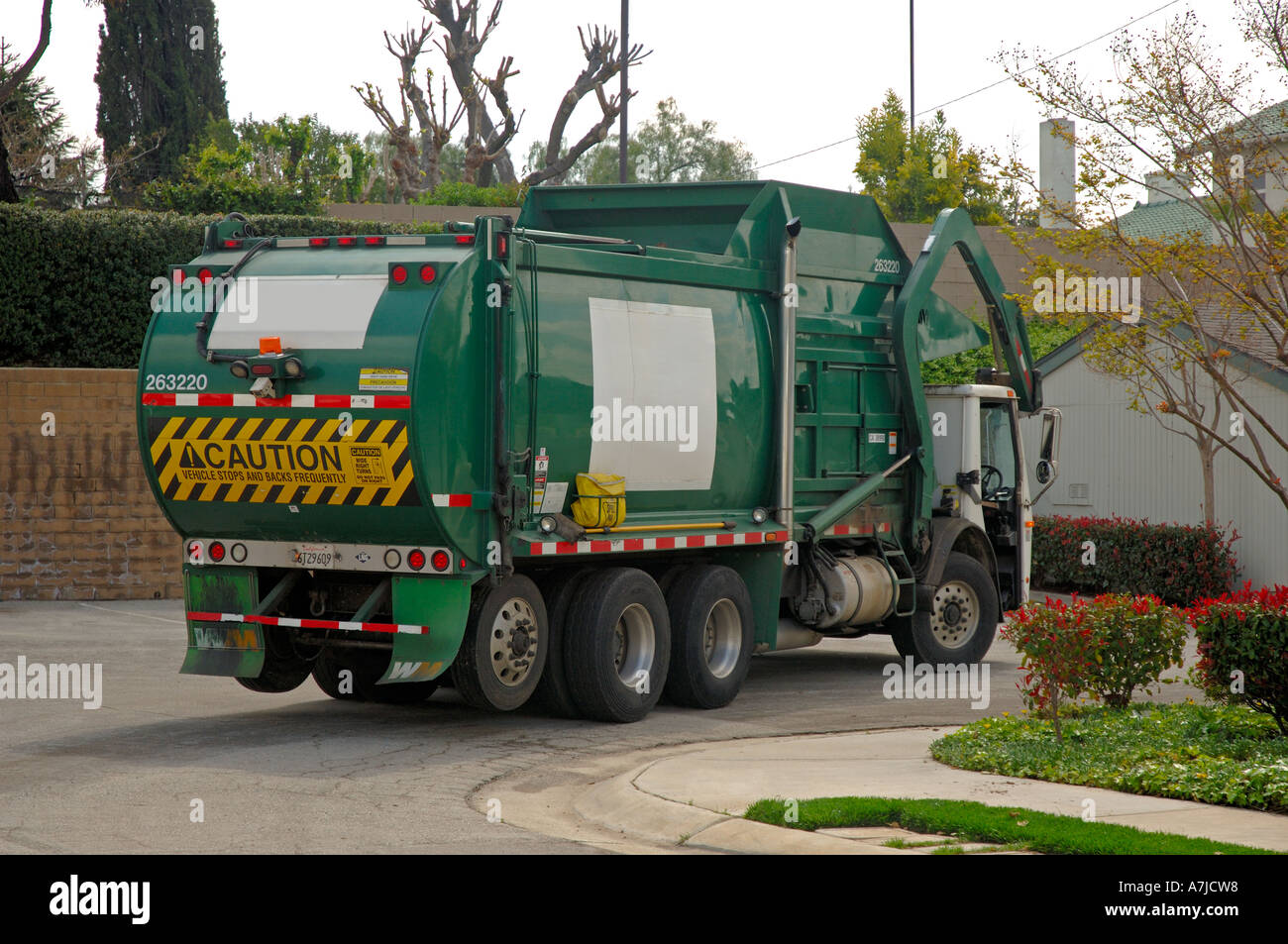 Garbage truck collecting waste Stock Photo Alamy