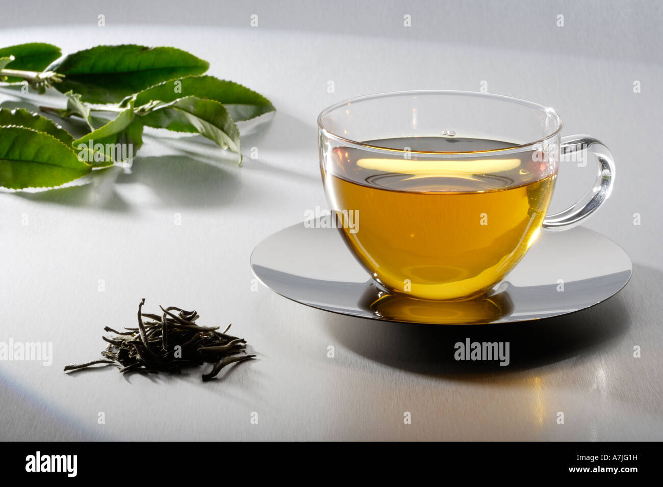Cup of tea with tea leaves Stock Photo