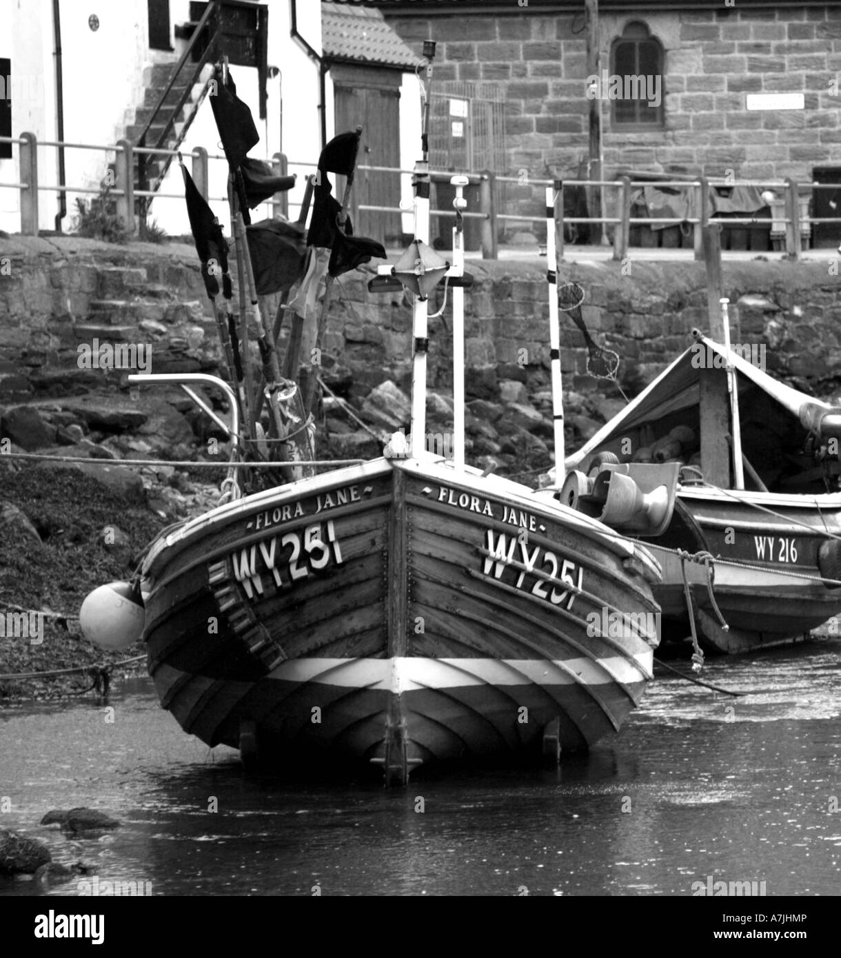Black and white fishing boat Staithes Harbour Stock Photo