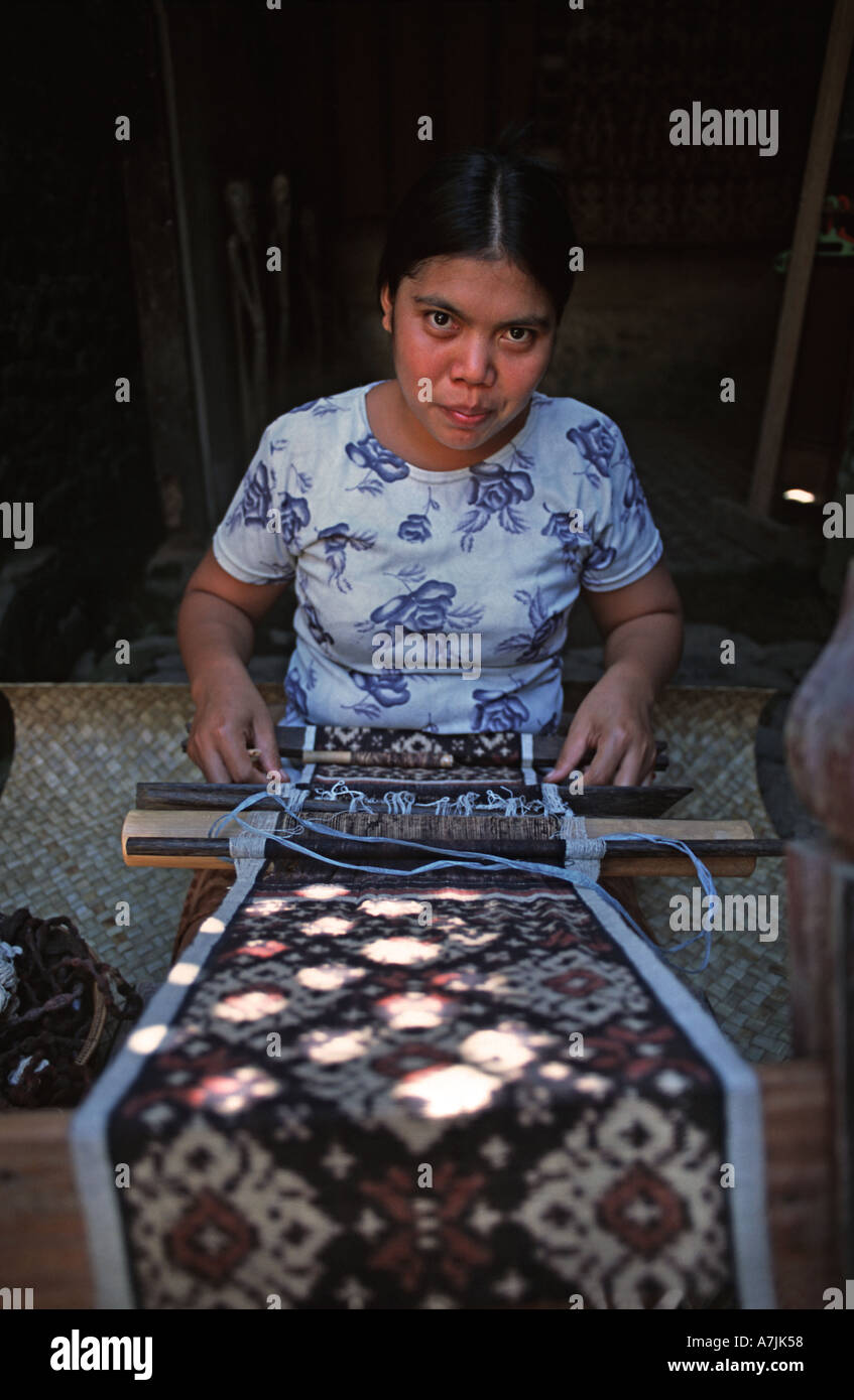 Woman weaving double ikat cloth called grinsing Tenganan village Bali Indonesia Grinsing geringsing Stock Photo