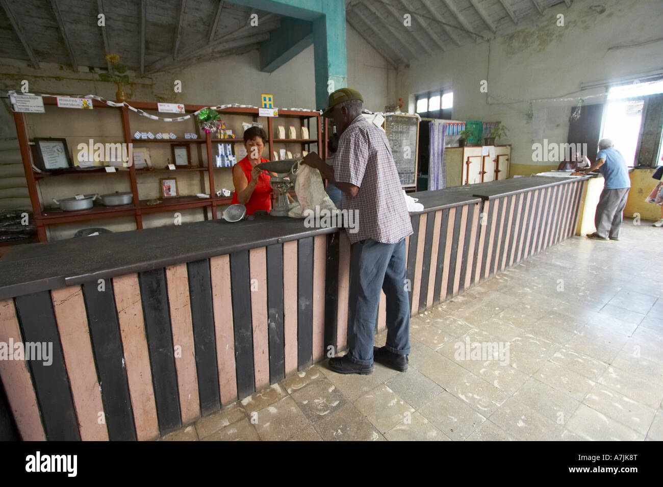 Man collection rations from ration shop, Santa Clara, Cuba Stock Photo