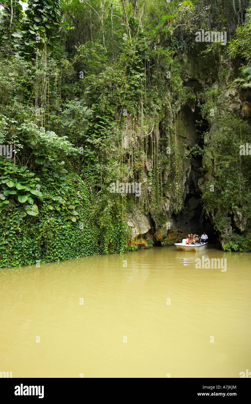 Boat emerging from caves, Cueva del indio, Cuba Stock Photo