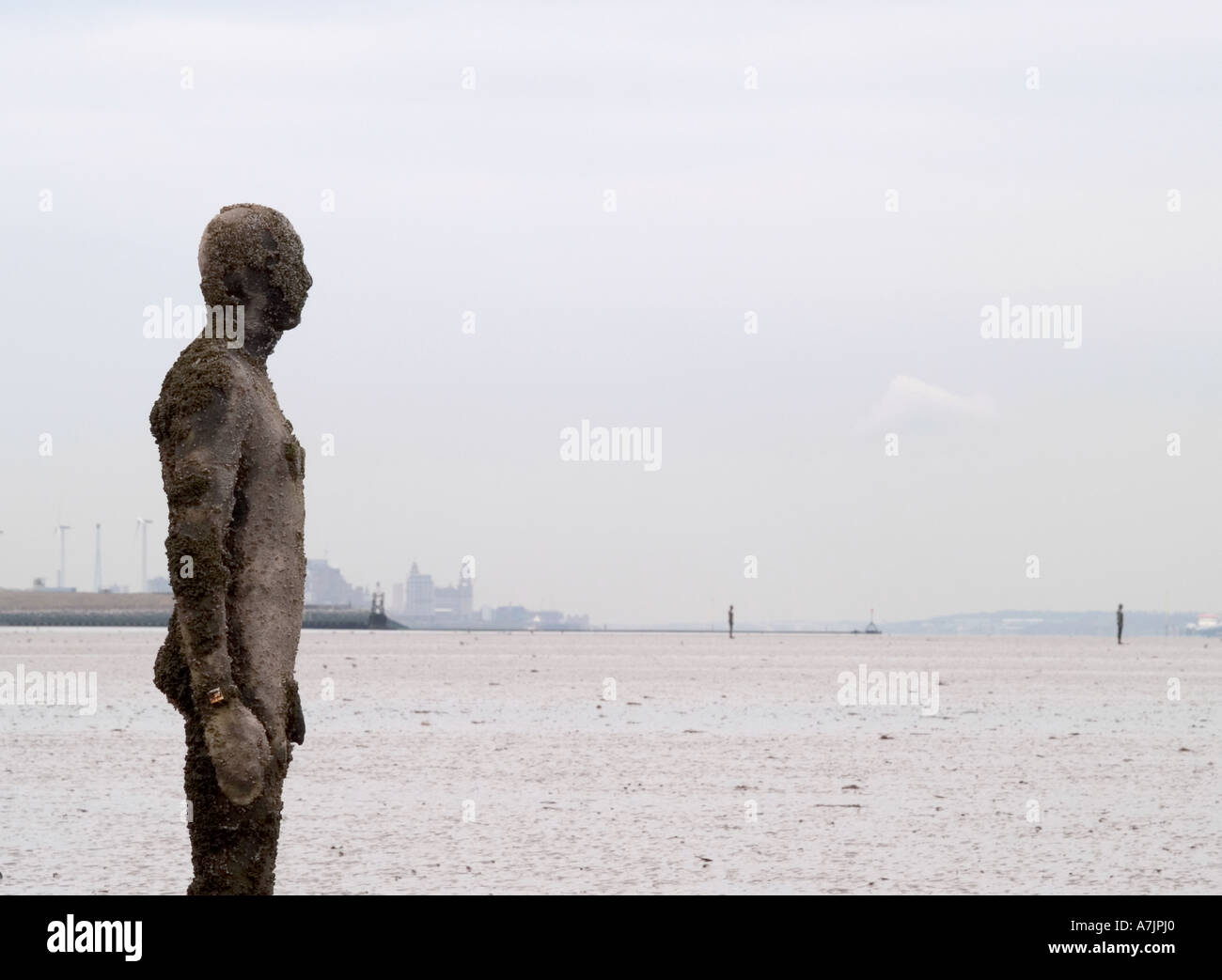 ANTONY GORMLEY SCULPTURED FIGURES ON BEACH AT CROSBY, LIVERPOOL