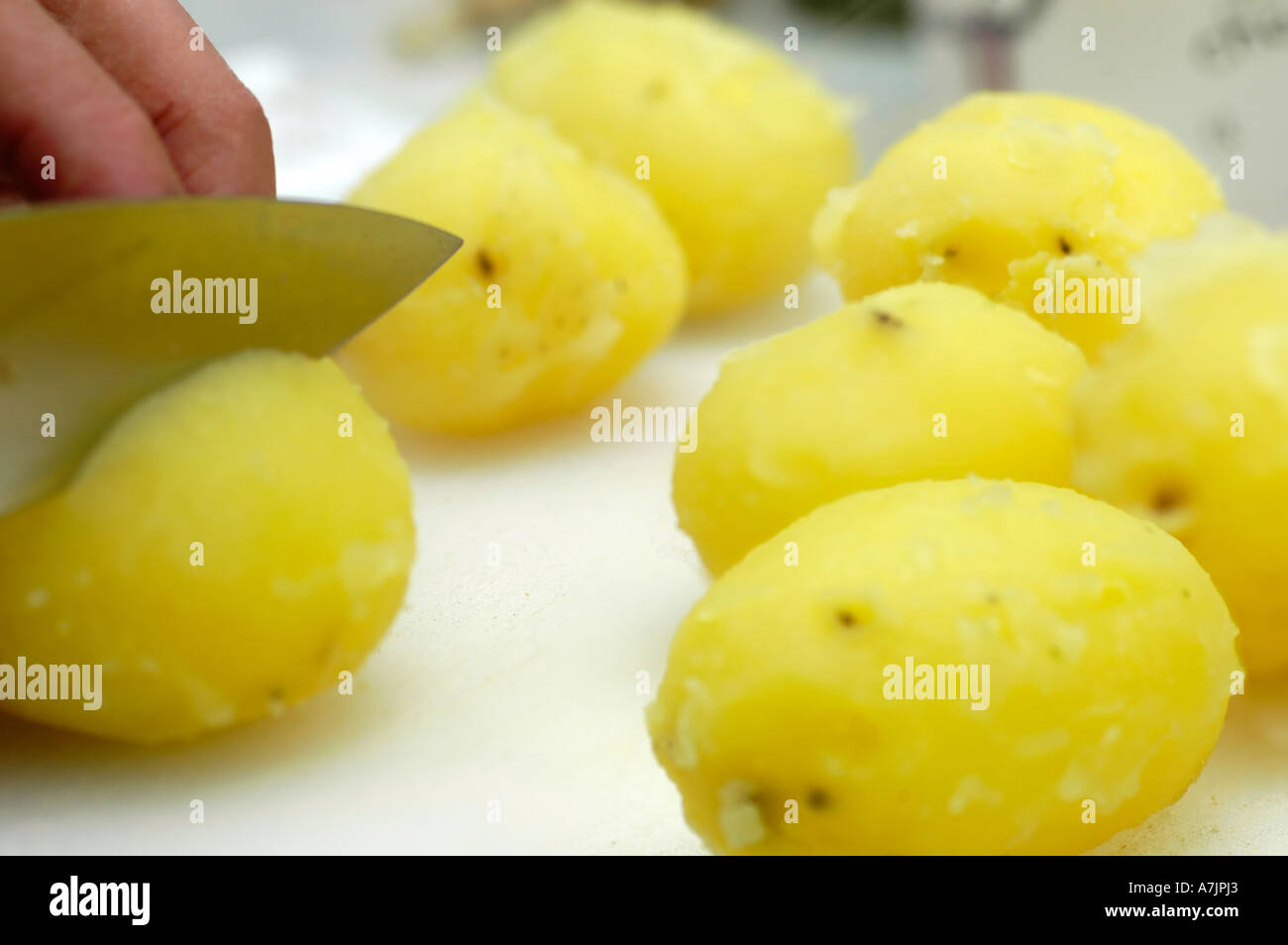 Cutting potatoes Stock Photo