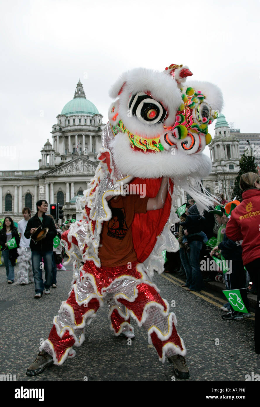 vertical Chinese dragon taking part in the st Patricks Day parade in front of Belfast City Hall 2007 Stock Photo